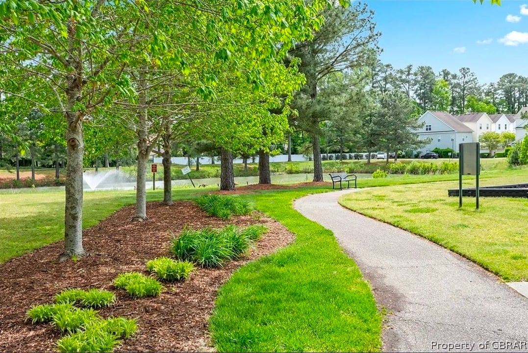 Greenbelt walking path through the landscaped grounds at 957 Lux